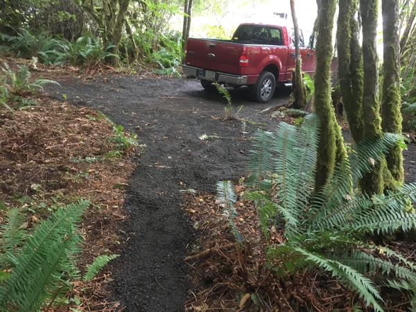 It took two truck loads of gravel, approximately one cubic yard, to finish the driveway, turn-around area, and path.